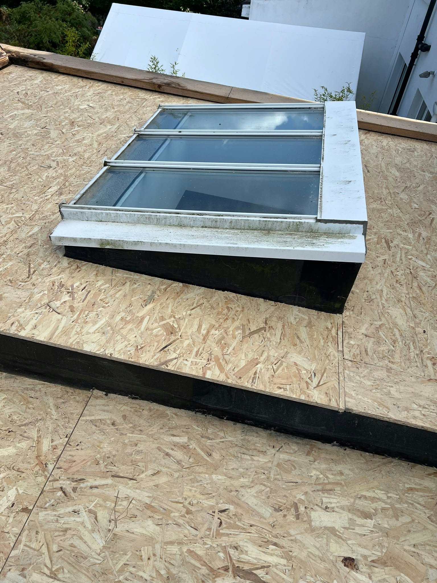Roofers working on an old roof in Cork City