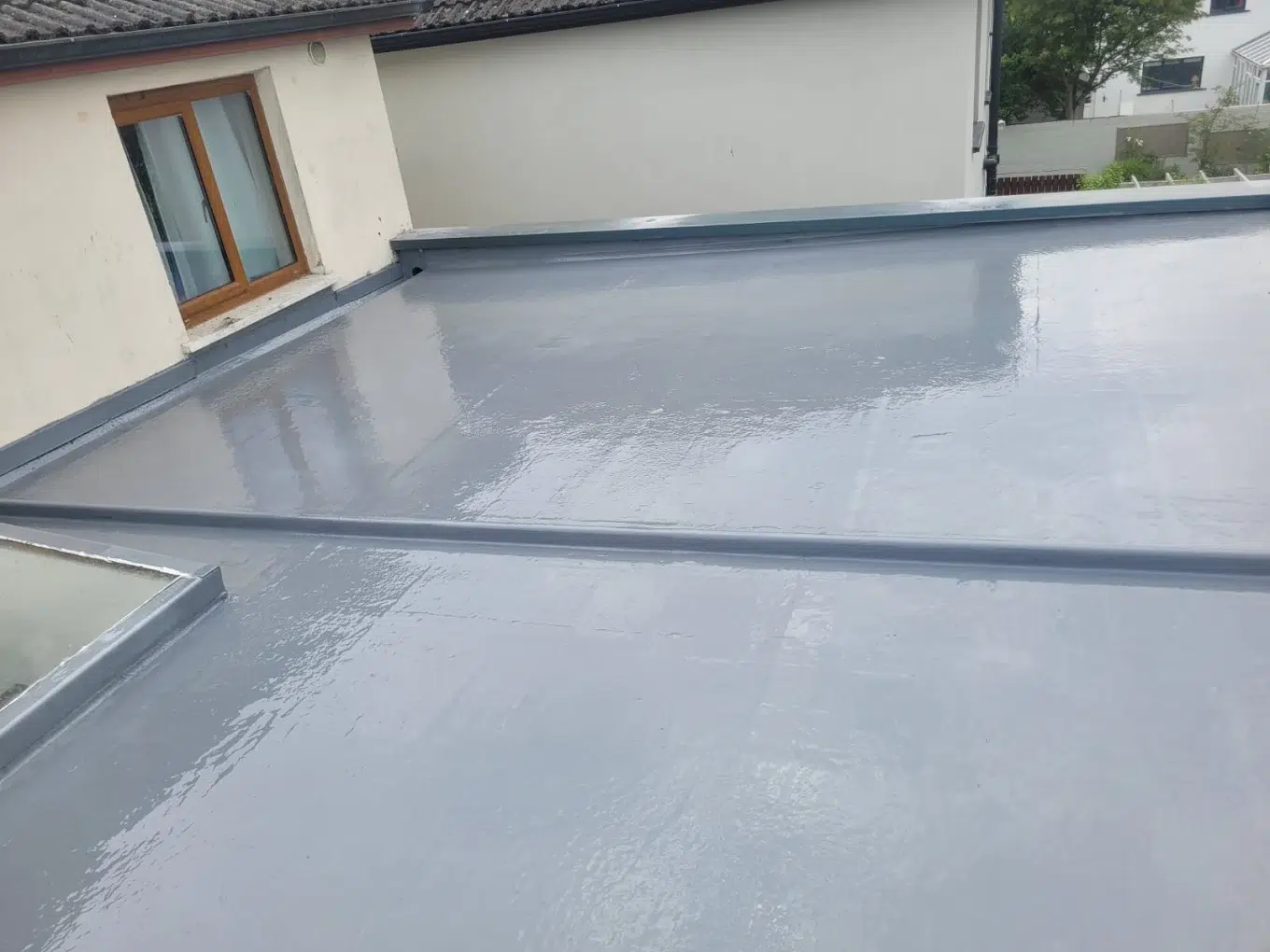 Roofers working on an old roof in Cork City