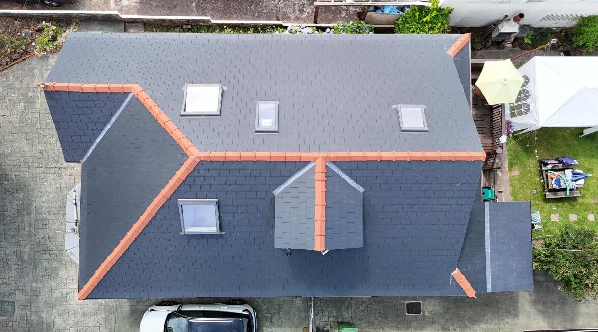 Roofers working on an old roof in Cork City