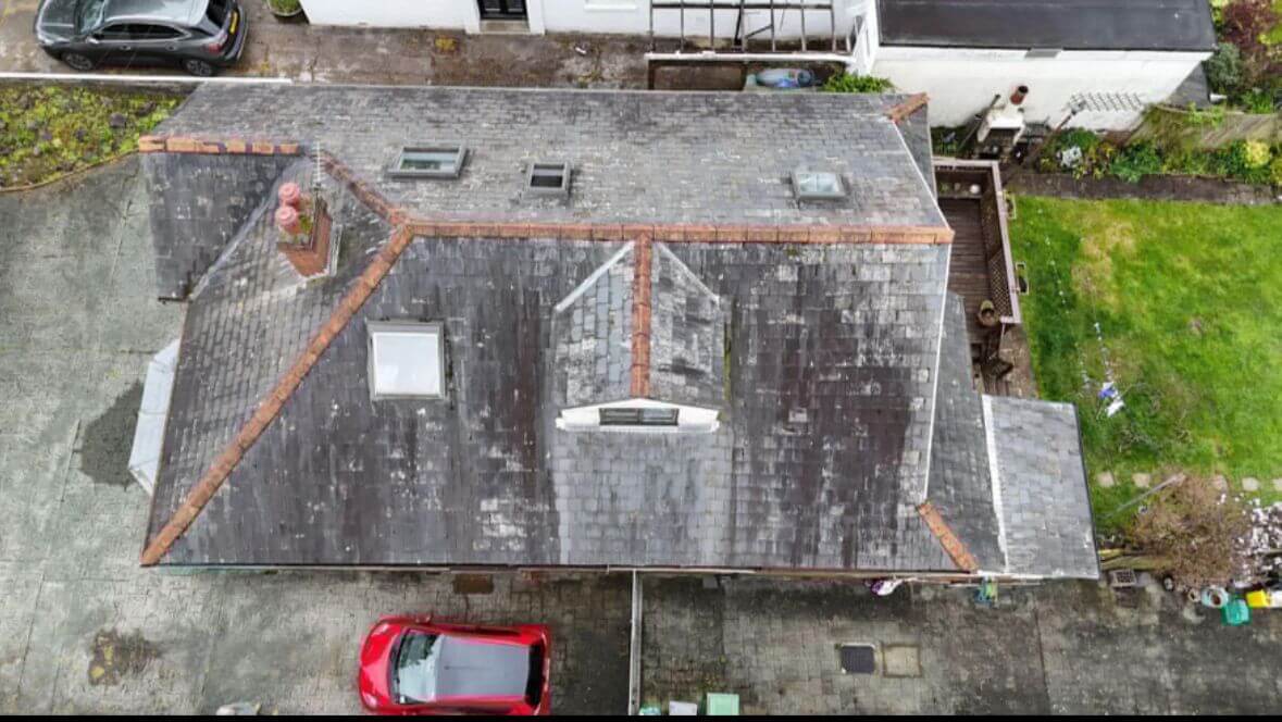 Roofers working on an old roof in Cork City